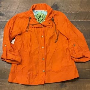 Orange wind breaker jacket.